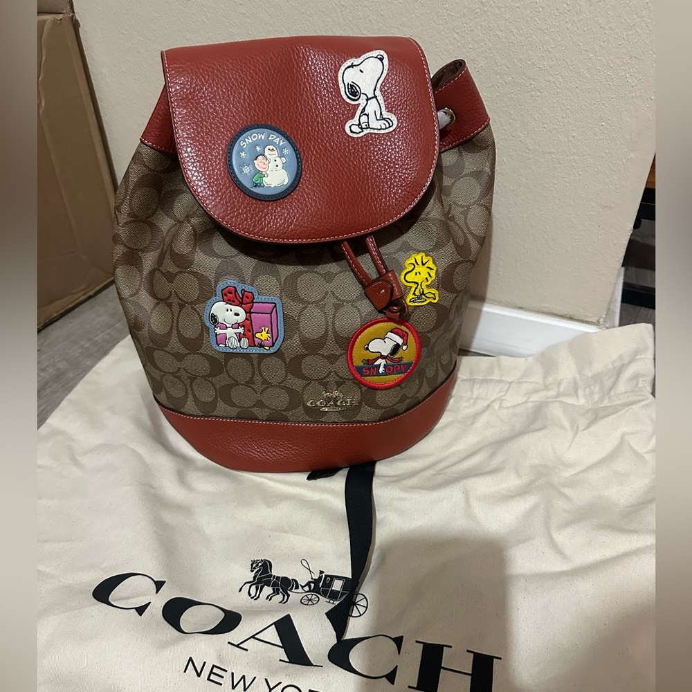 Coach Peanuts Snoopy backpack with patches. Brand new. Dust bag not included.